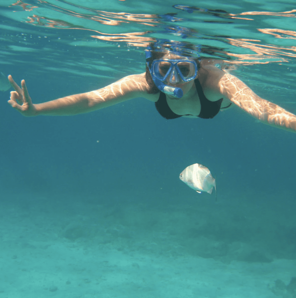 Snorkeling in clear turquoise water in the Caribbean Sea